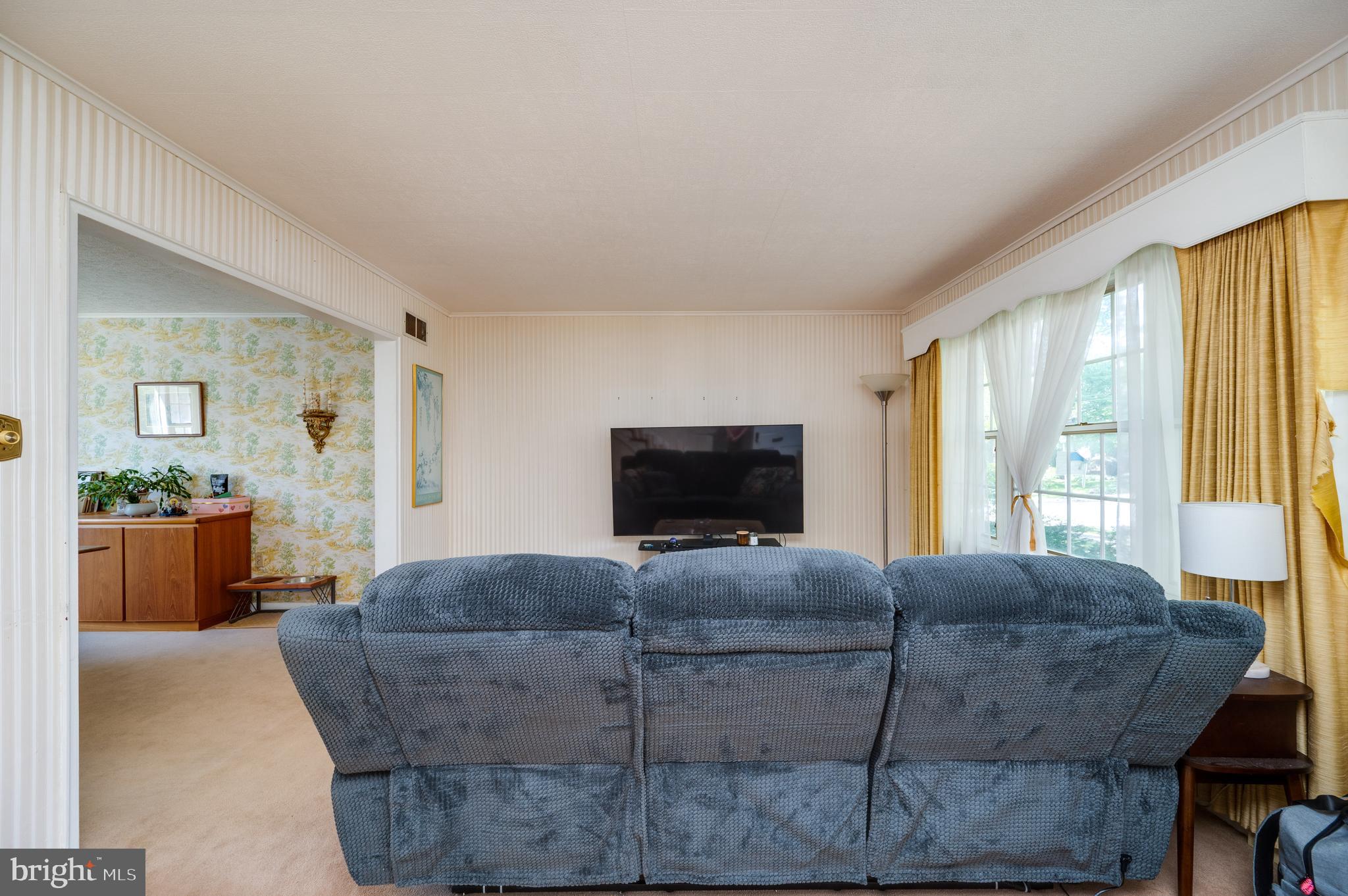 435 Sycamore Road Reading, PA 19611 - Photo 7 of 42 a living room with furniture and a flat screen tv