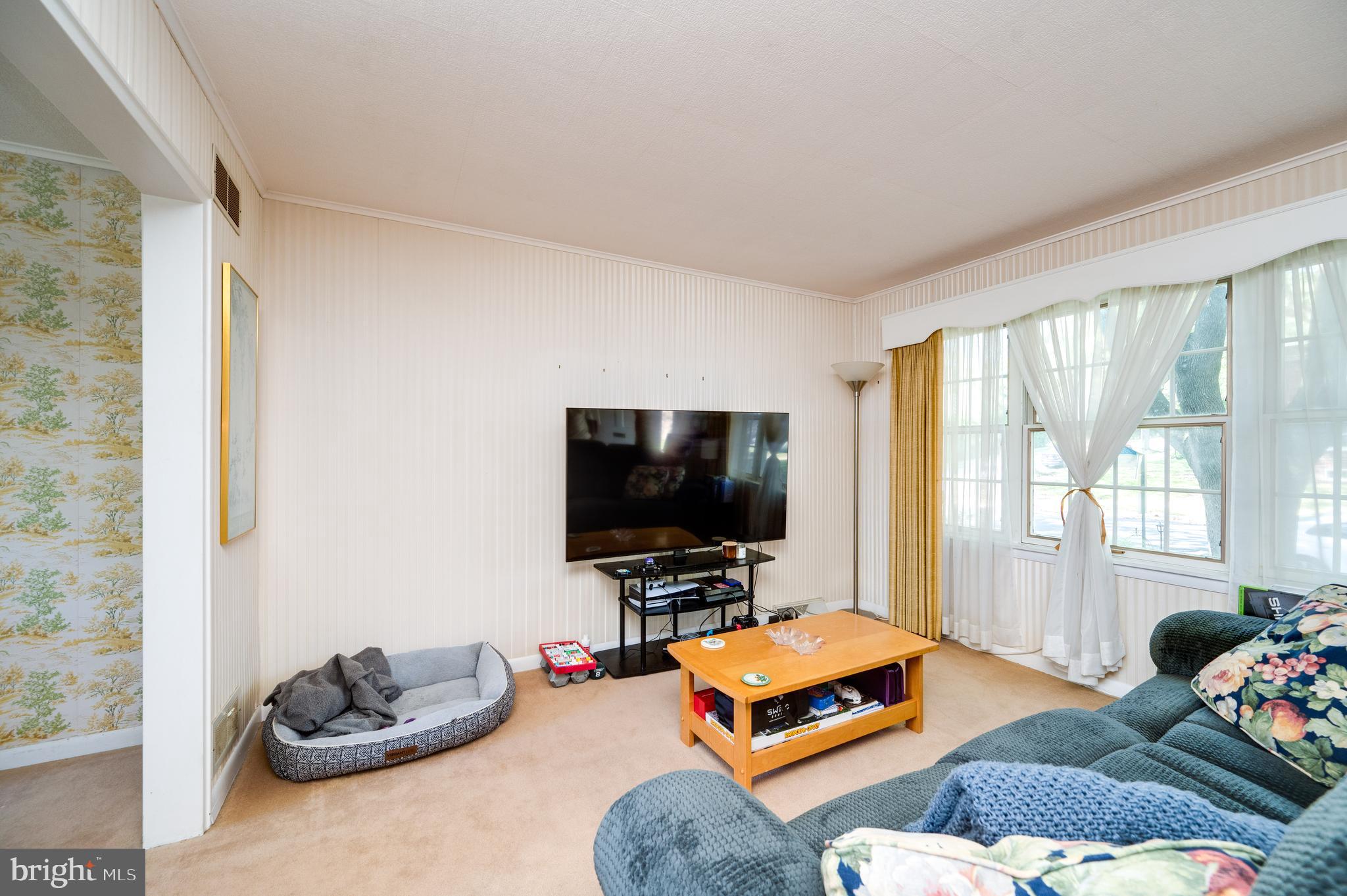 435 Sycamore Road Reading, PA 19611 - Photo 9 of 42 a living room with furniture and a flat screen tv