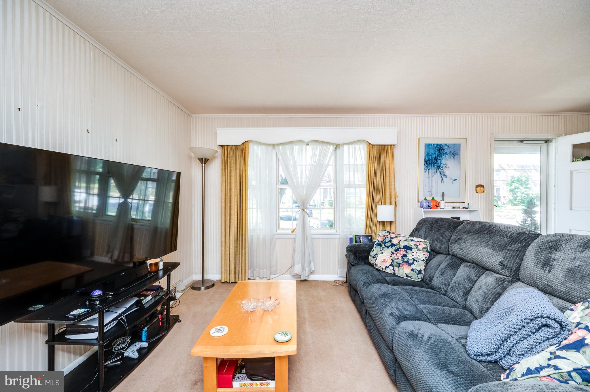 435 Sycamore Road Reading, PA 19611 - Photo 10 of 42 a living room with furniture and a flat screen tv