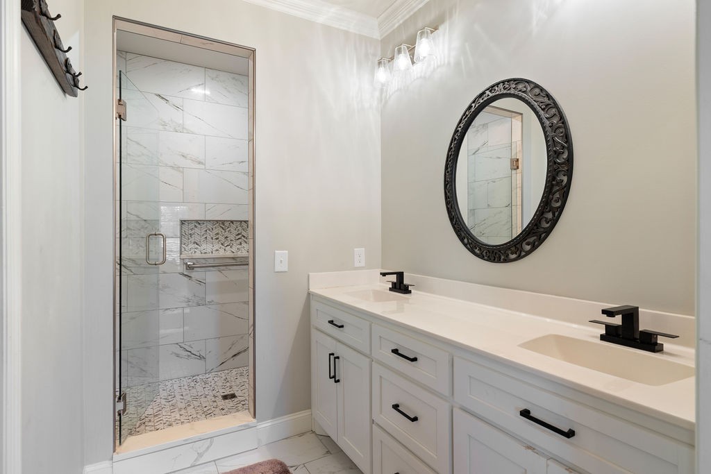 411 Bumpas Road Lawrenceburg, TN 38464 - Photo 16 of 30 a bathroom with a sink a toilet and a mirror