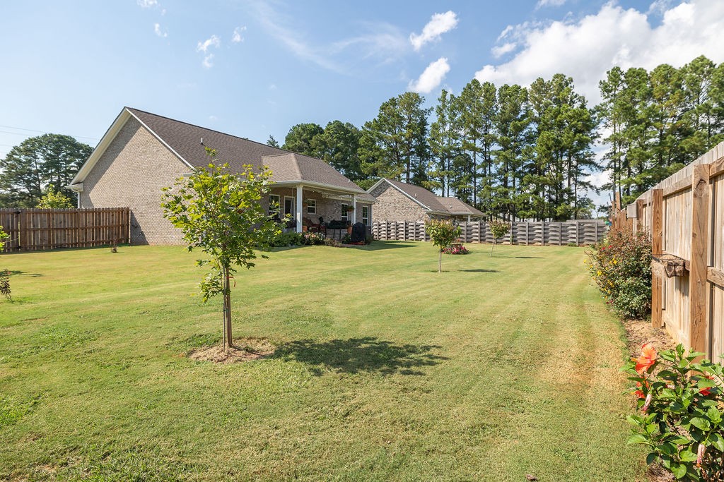 411 Bumpas Road Lawrenceburg, TN 38464 - Photo 28 of 30 a swimming pool with some plants in front of it