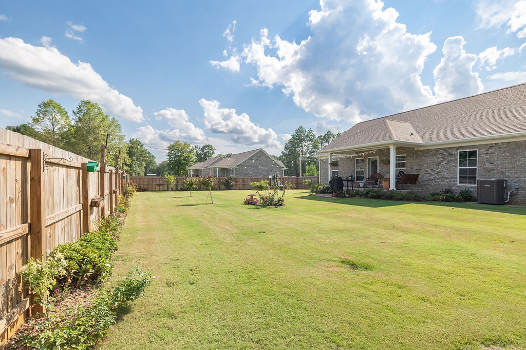 411 Bumpas Road Lawrenceburg, TN 38464 - Photo 29 of 30 a view of a swimming pool with an outdoor space and seating area