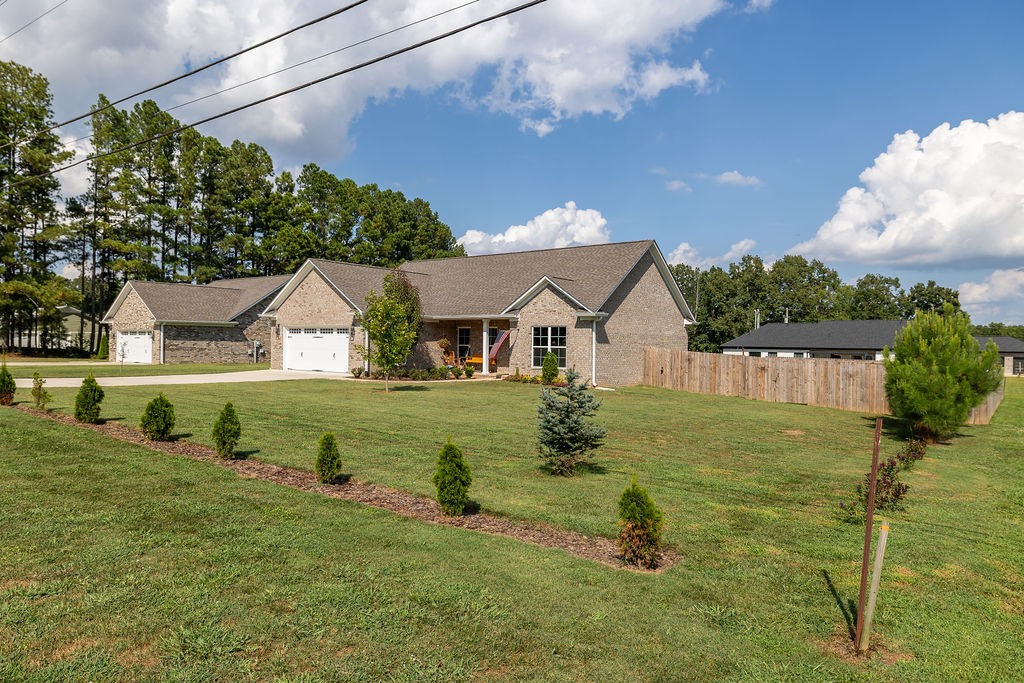 411 Bumpas Road Lawrenceburg, TN 38464 - Photo 30 of 30 a house view with a garden space