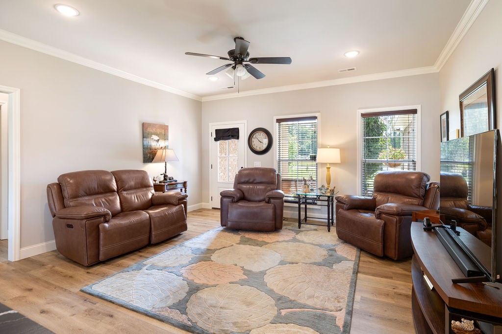 411 Bumpas Road Lawrenceburg, TN 38464 - Photo 7 of 30 a living room with furniture ceiling fan and a window