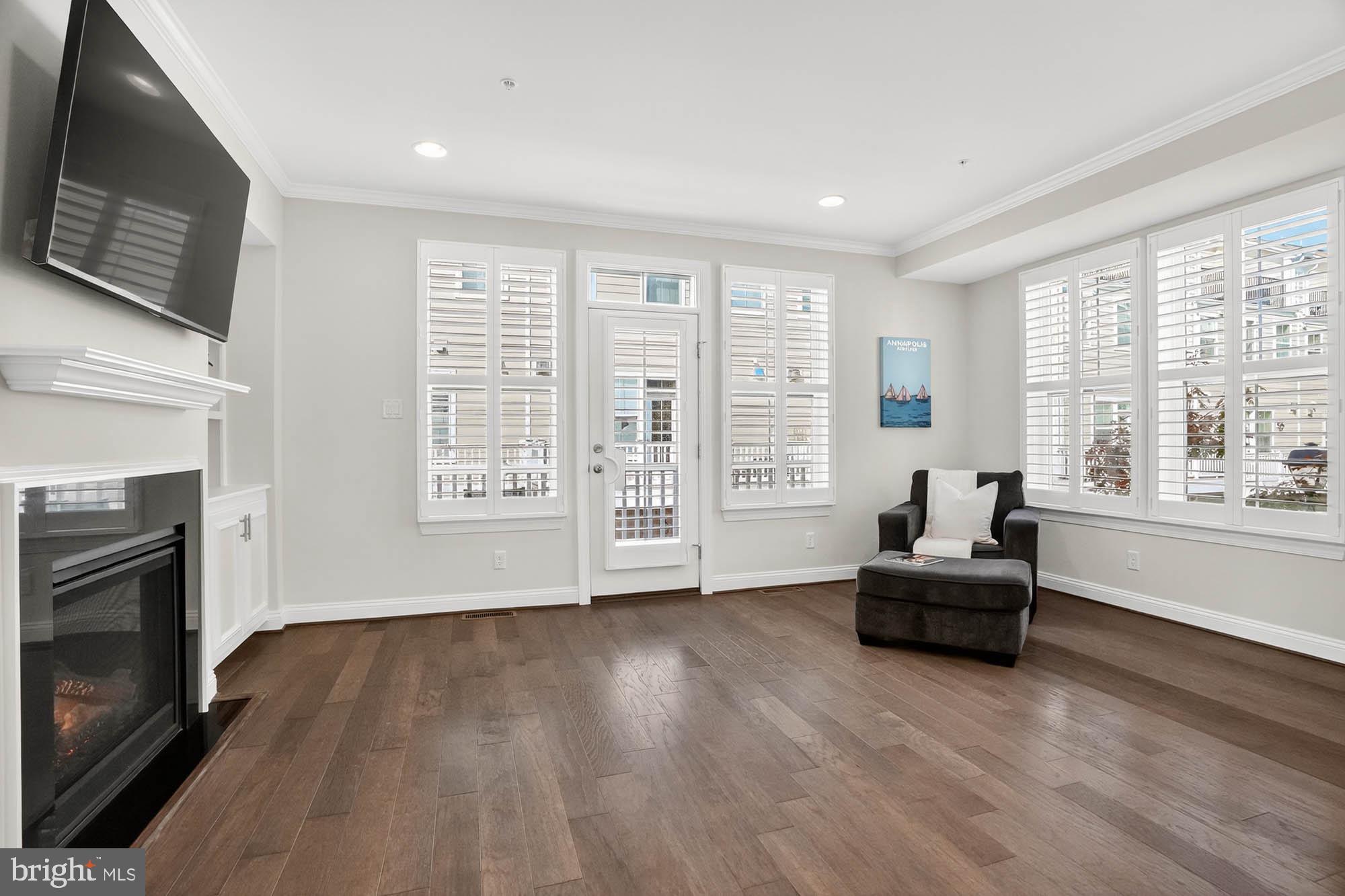 606 James Walker Place Annapolis, MD 21401 - Photo 11 of 52 a living room with furniture and a flat screen tv