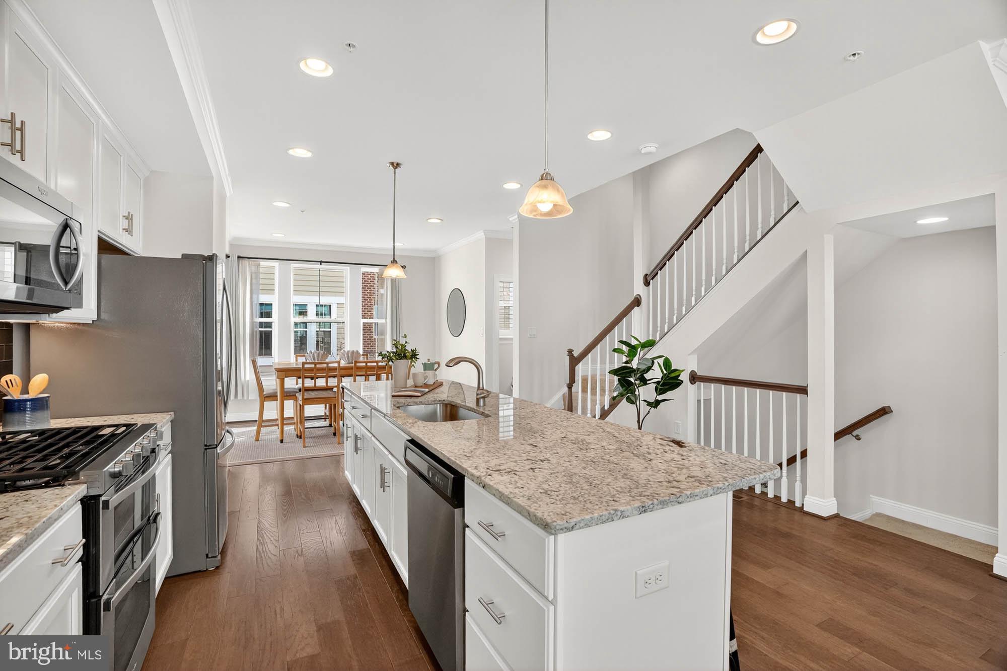 606 James Walker Place Annapolis, MD 21401 - Photo 16 of 52 a kitchen with sink stove and cabinets