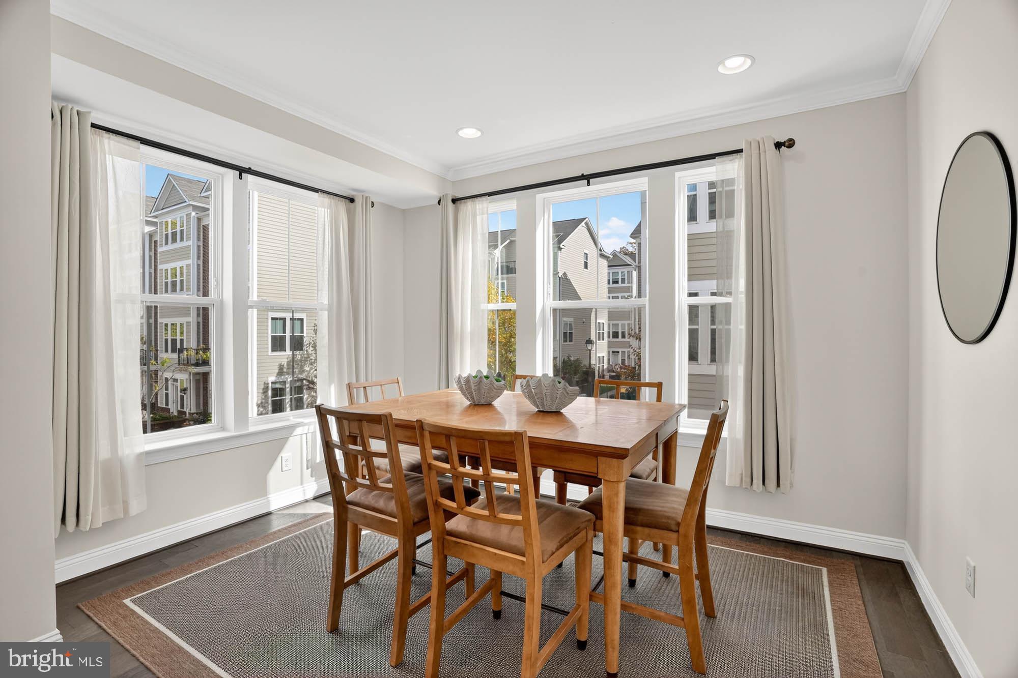 606 James Walker Place Annapolis, MD 21401 - Photo 23 of 52 a dining room with furniture a chandelier and wooden floor