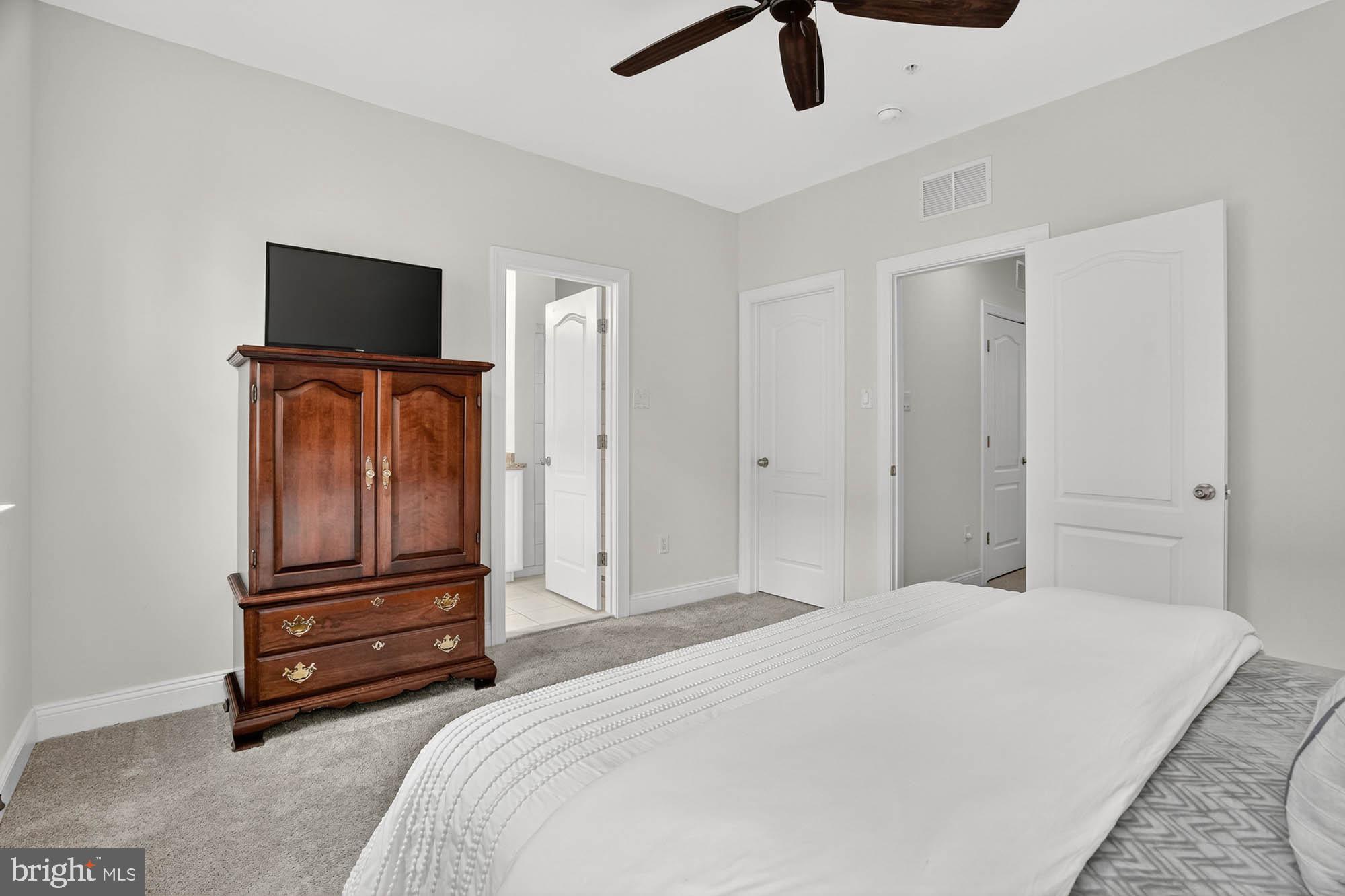606 James Walker Place Annapolis, MD 21401 - Photo 28 of 52 a bedroom with a bed and a flat screen tv