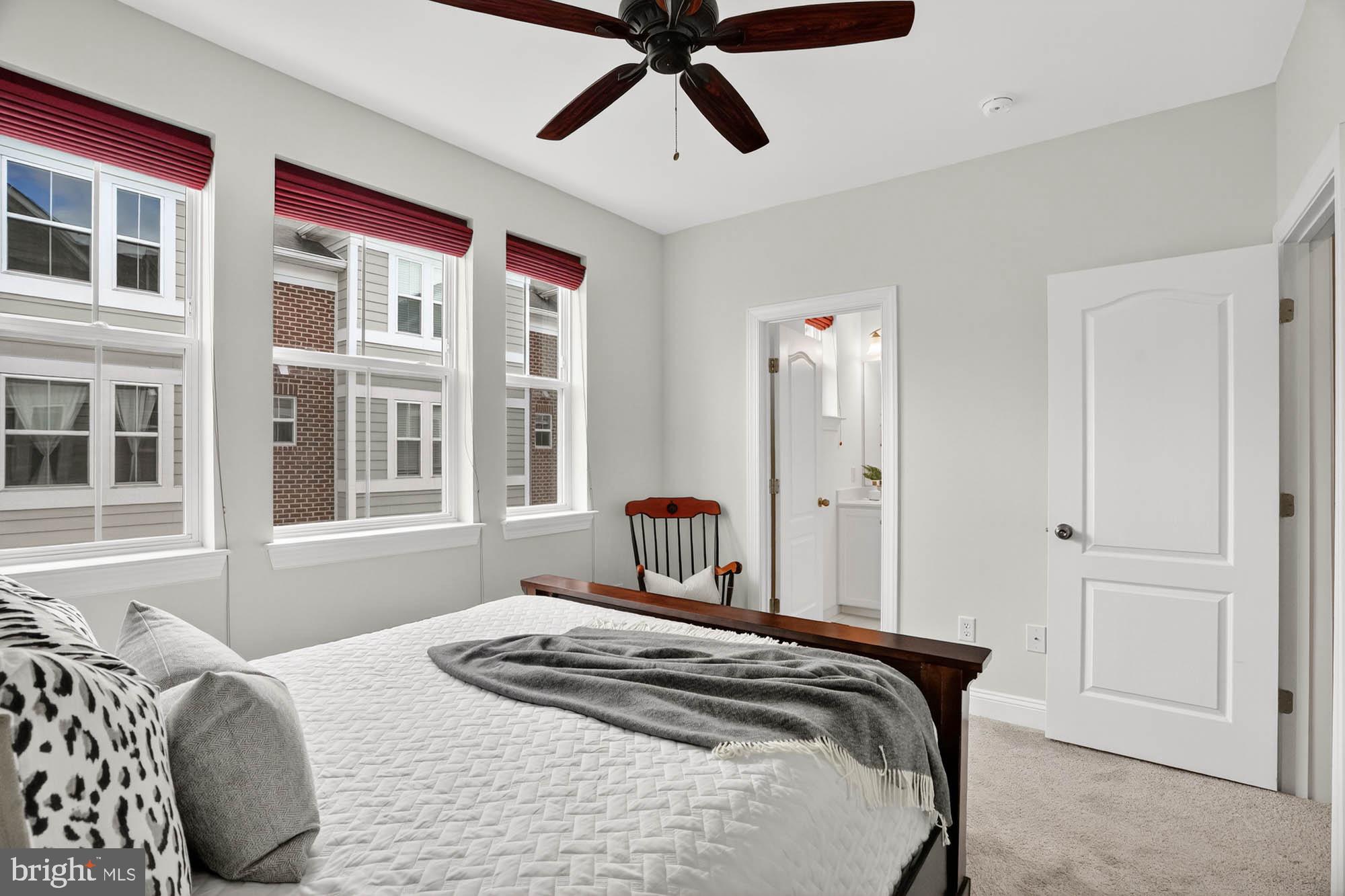 606 James Walker Place Annapolis, MD 21401 - Photo 32 of 52 a bedroom with a bed and wooden floor