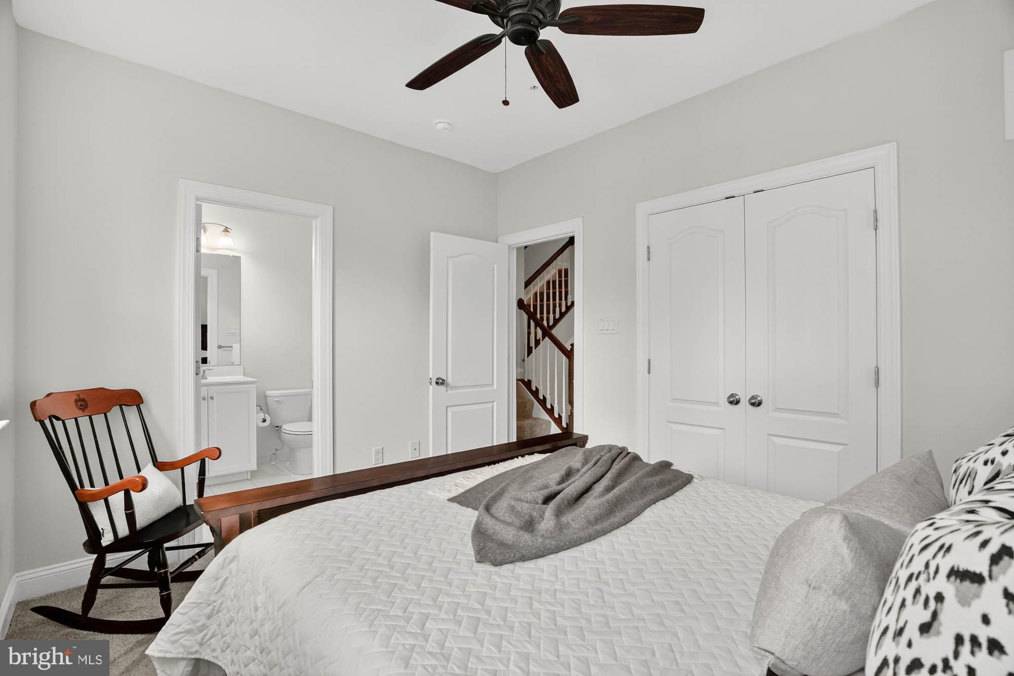 606 James Walker Place Annapolis, MD 21401 - Photo 33 of 52 a bedroom with a bed and a chair