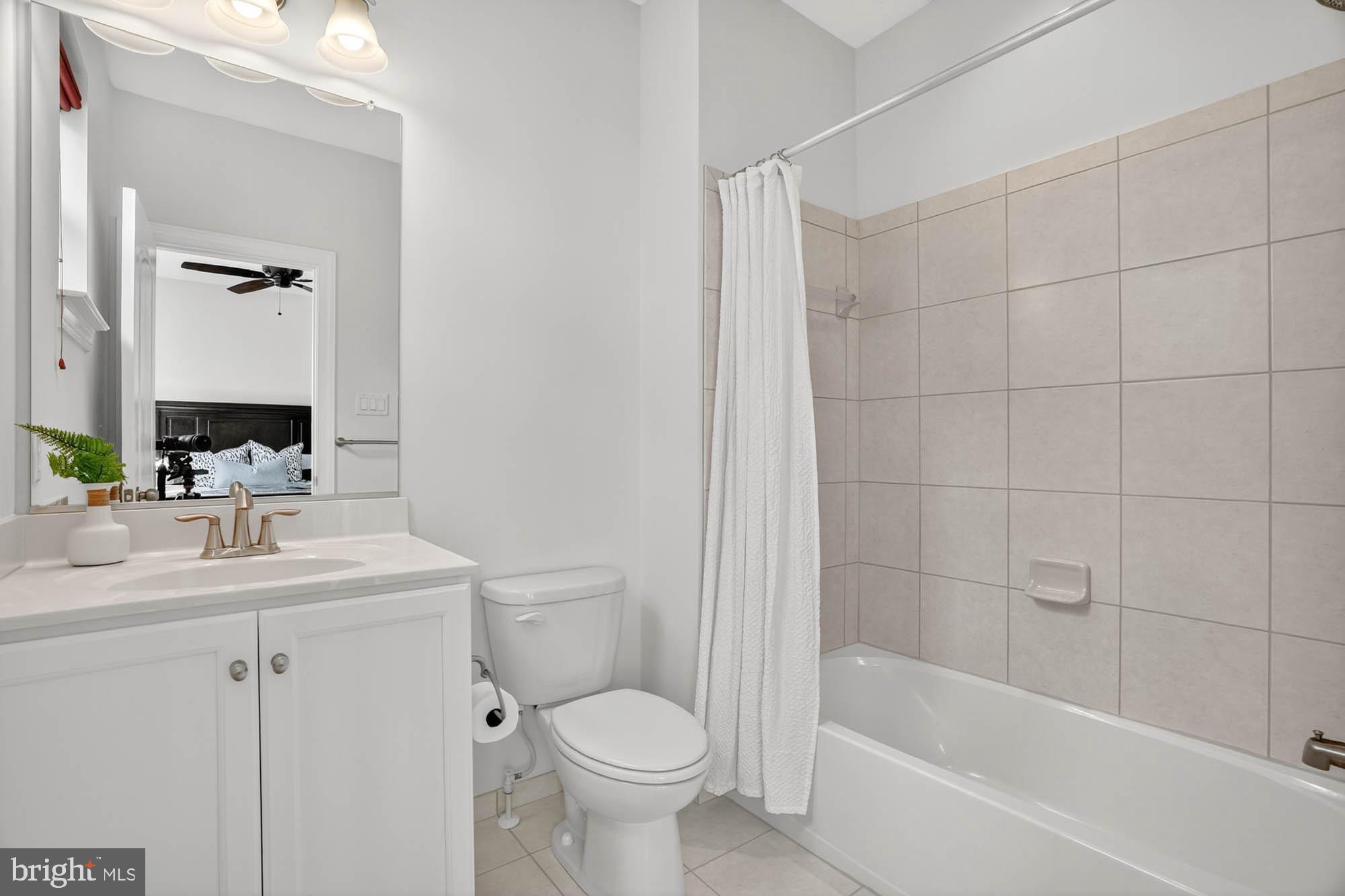 606 James Walker Place Annapolis, MD 21401 - Photo 34 of 52 a bathroom with a sink a toilet and shower