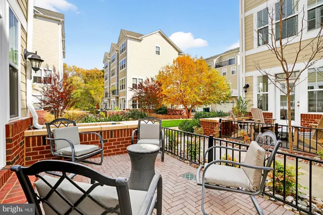 a view of a workspace with furniture