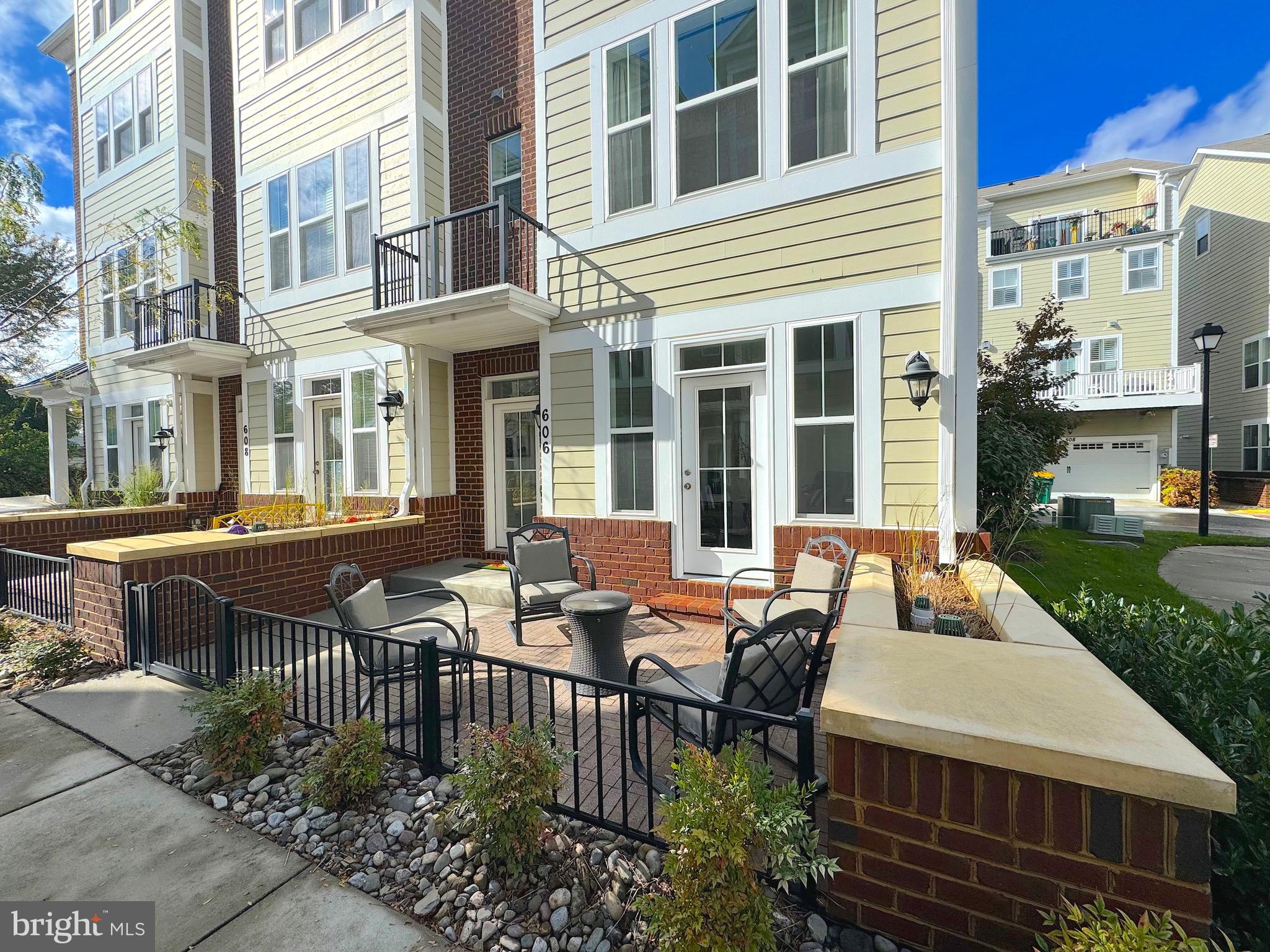 606 James Walker Place Annapolis, MD 21401 - Photo 47 of 52 a view of a patio with couches table and chairs and potted plants