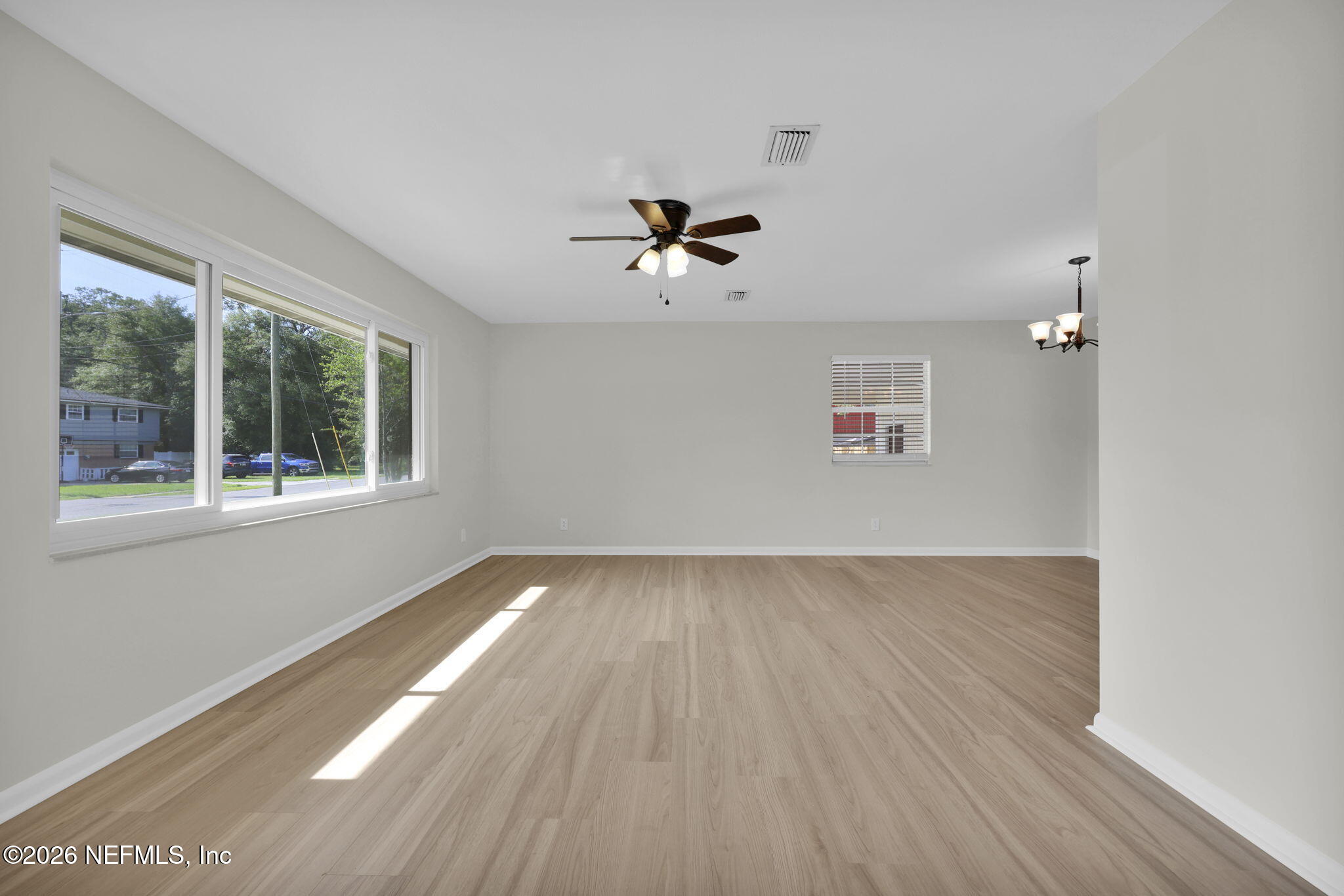 8544 Sanchez Road Jacksonville, FL 32217 - Photo 10 of 46 wooden floor in an empty room with a window
