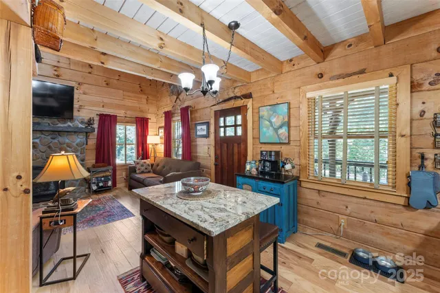 a living room with furniture a fireplace and a table