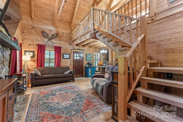 a living room with furniture oven and a rug