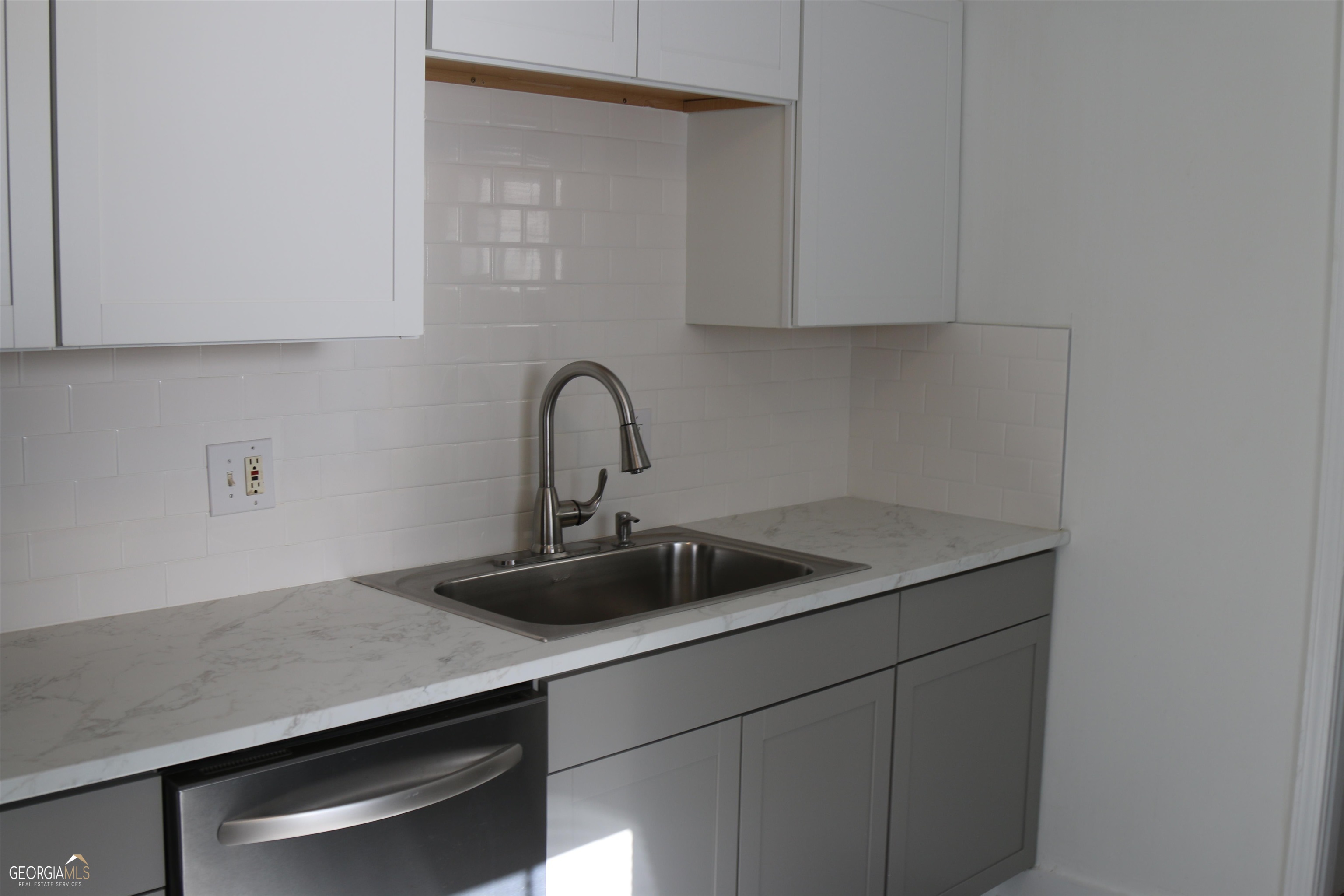 2577 Eastwood Drive Decatur, GA 30032 - Photo 8 of 21 a kitchen with a sink and cabinets