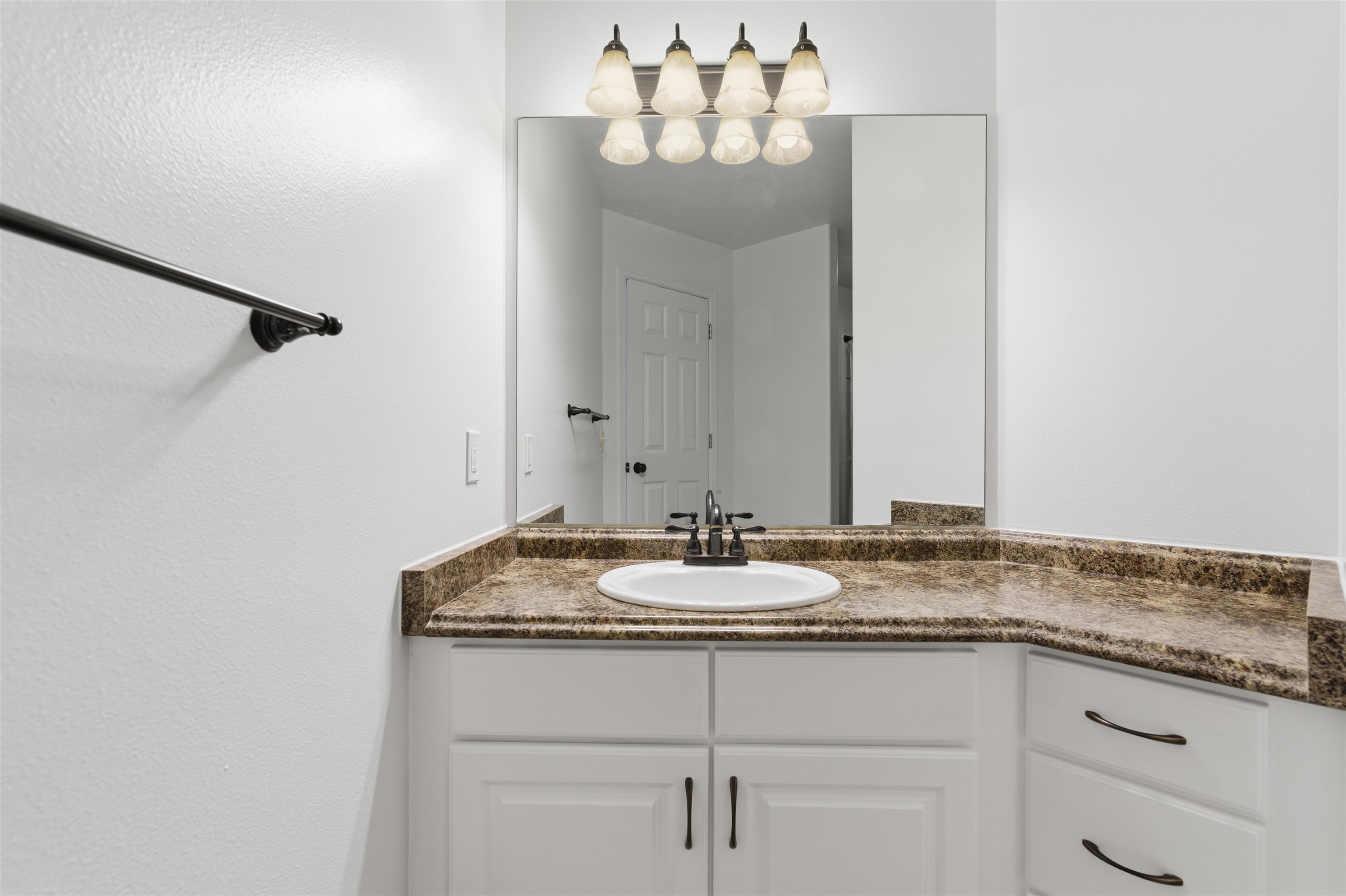 1820 Bittern Court Grand Junction, CO 81506 - Photo 18 of 28 a bathroom with a granite countertop sink and a mirror