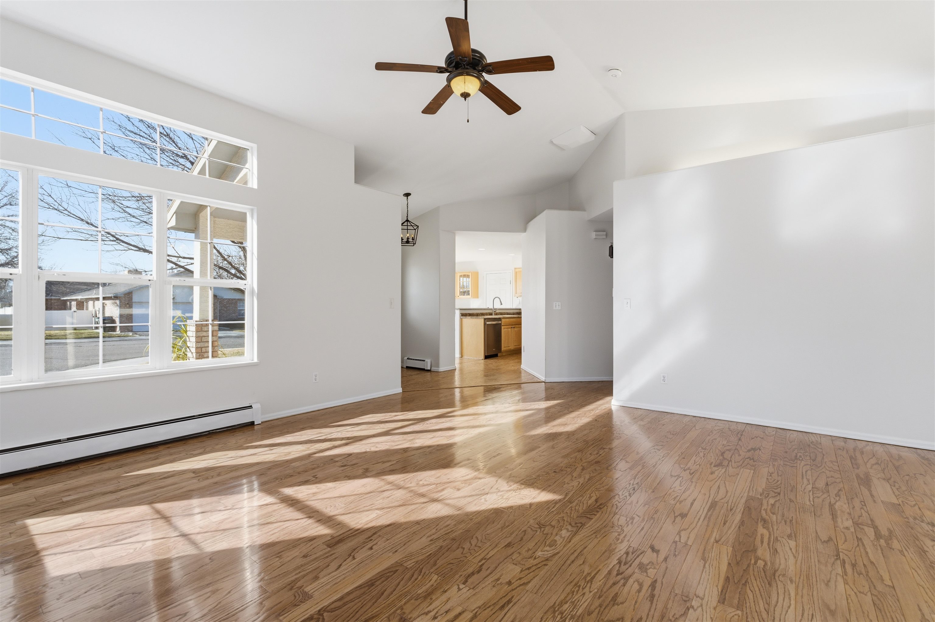 1820 Bittern Court Grand Junction, CO 81506 - Photo 4 of 28 a view of an empty room with window and wooden floor