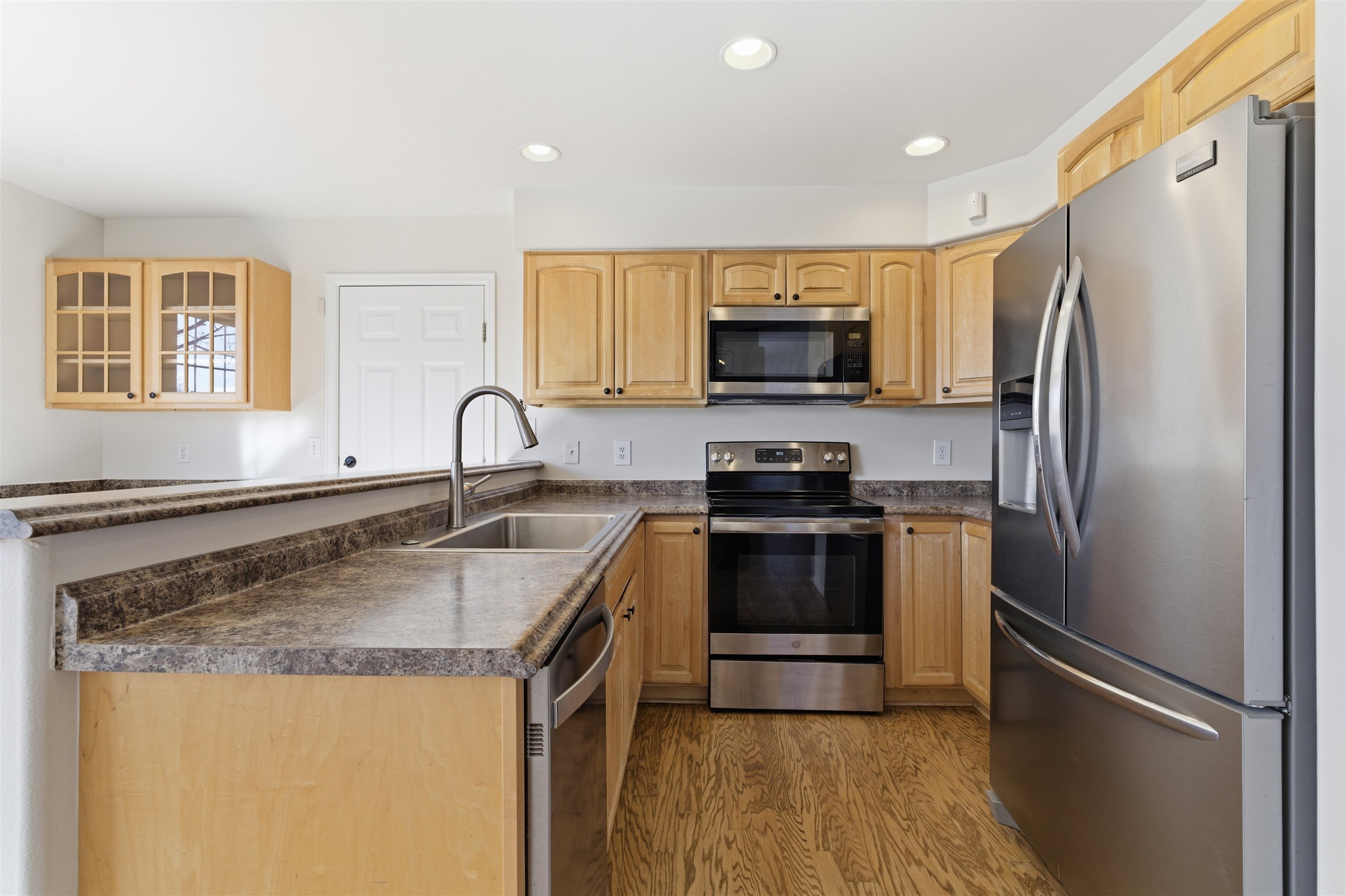 1820 Bittern Court Grand Junction, CO 81506 - Photo 6 of 28 a kitchen with a refrigerator sink and stove