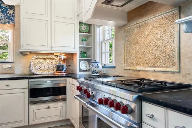 a view of a bedroom with wooden floor