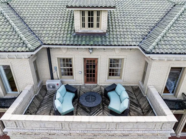 a view of balcony with furniture