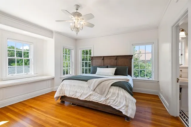 a kitchen with granite countertop white cabinets and window