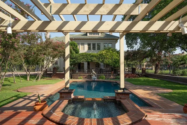 a view of a park with large trees and a small yard
