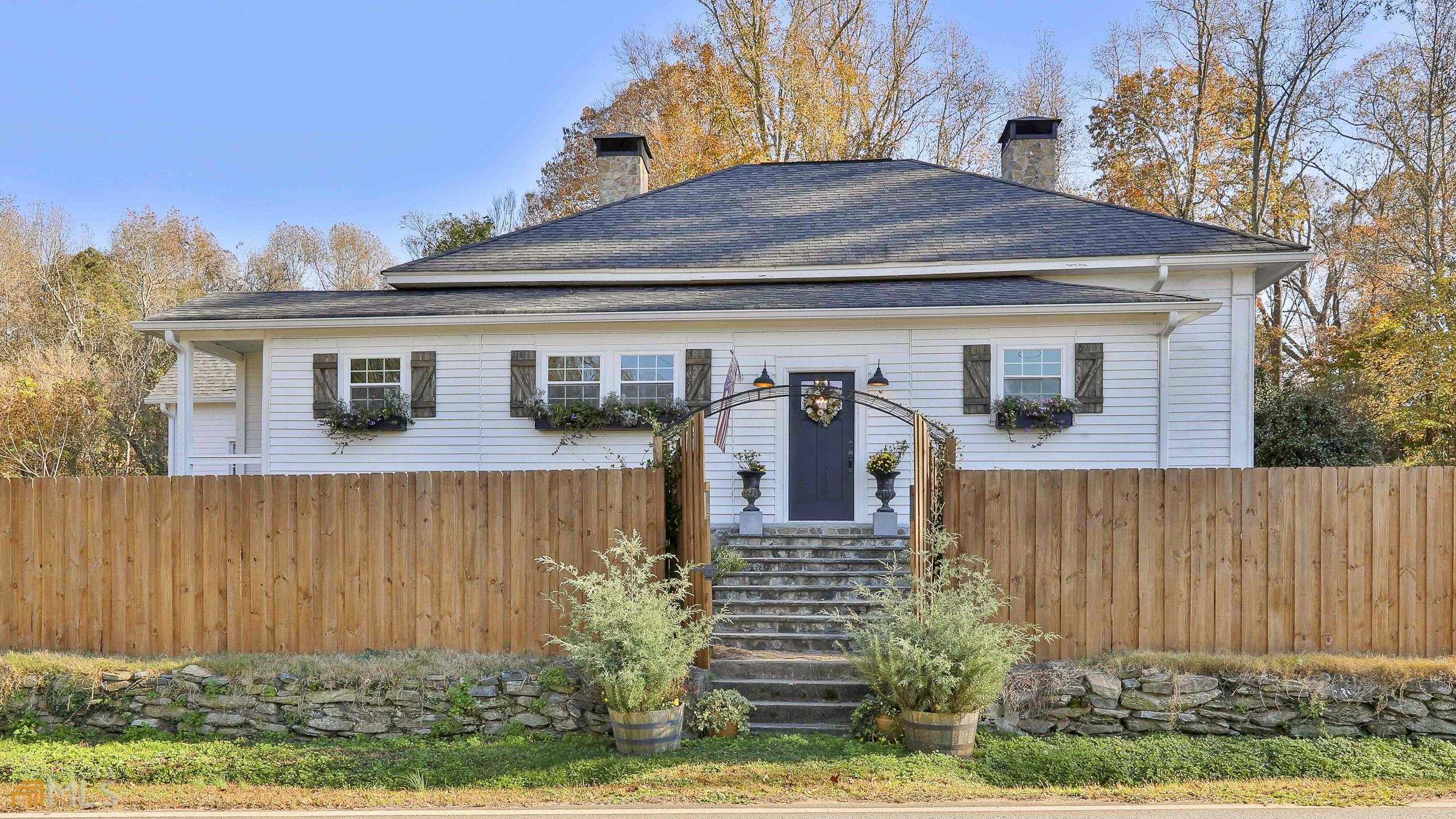 front view of a house with a fence