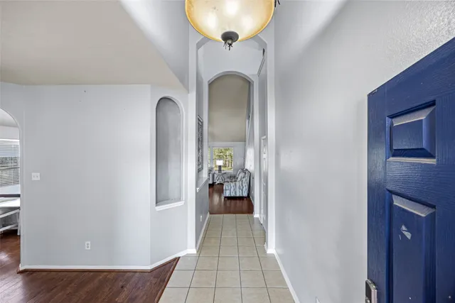 a view of a hallway view with staircase