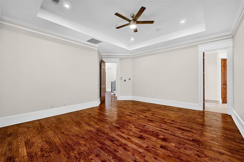 2910 Wellington Drive Sherman, TX 75092 - Photo 16 of 40 an empty room with wooden floor and windows