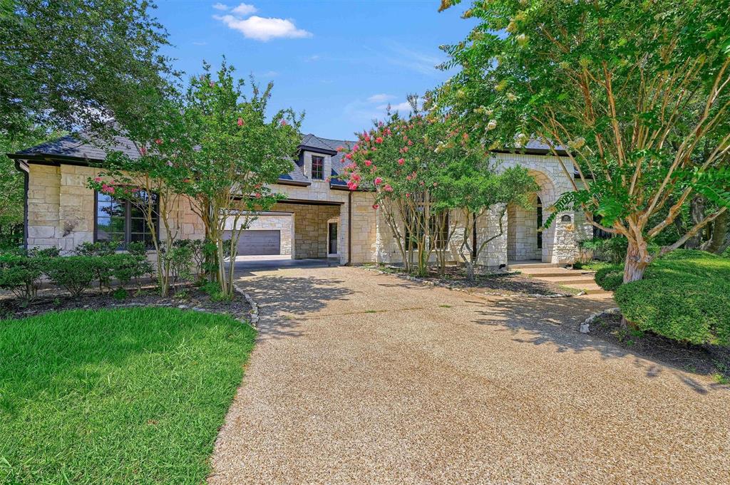 2910 Wellington Drive Sherman, TX 75092 - Photo 2 of 40 a front view of a house with a garden