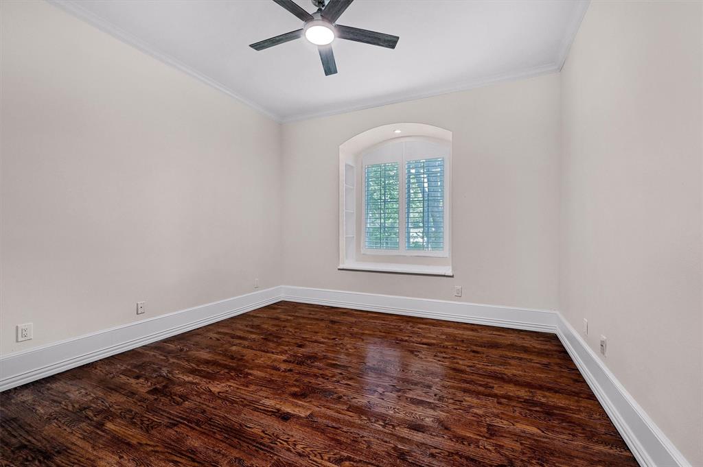 2910 Wellington Drive Sherman, TX 75092 - Photo 22 of 40 an empty room with wooden floor ceiling fan and window