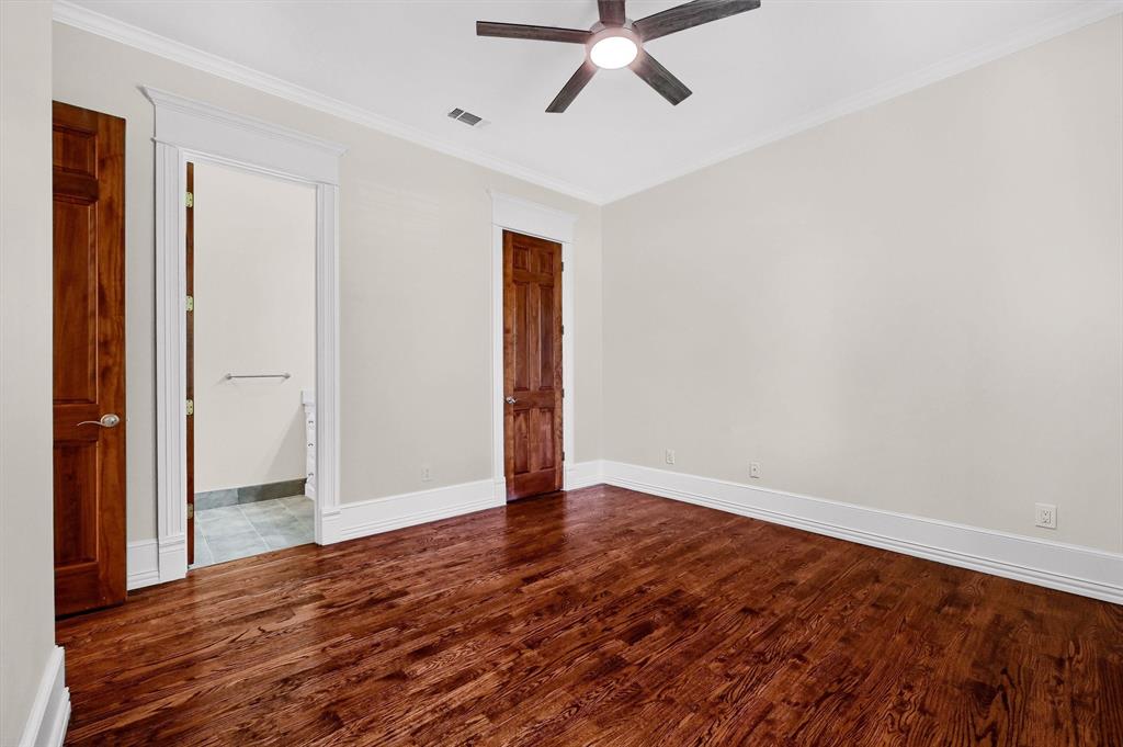 2910 Wellington Drive Sherman, TX 75092 - Photo 23 of 40 an empty room with wooden floor and windows