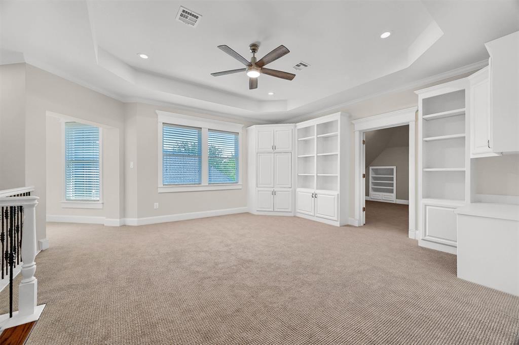 2910 Wellington Drive Sherman, TX 75092 - Photo 26 of 40 a view of an empty room with a window and a ceiling fan