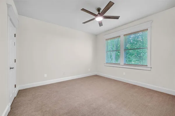 a bathroom with a shower a mirror and a sink
