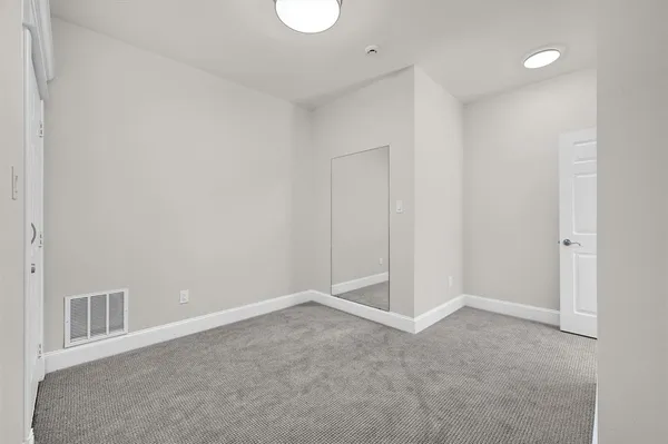 a view of a house with a yard and garage