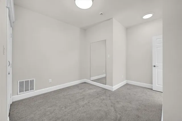 a view of a house with a yard and garage