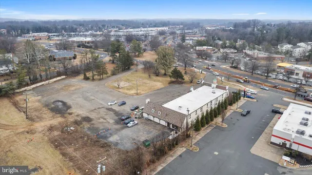 an aerial view of a houses with a city view