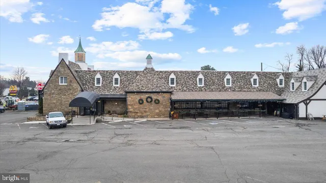 a view of a car park in front of house