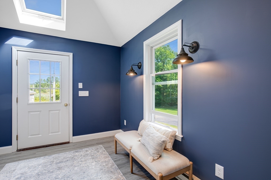 39 Middle Road, Unit A Newbury, MA 01951 - Photo 11 of 40 a view of a hallway with furniture and a potted plant