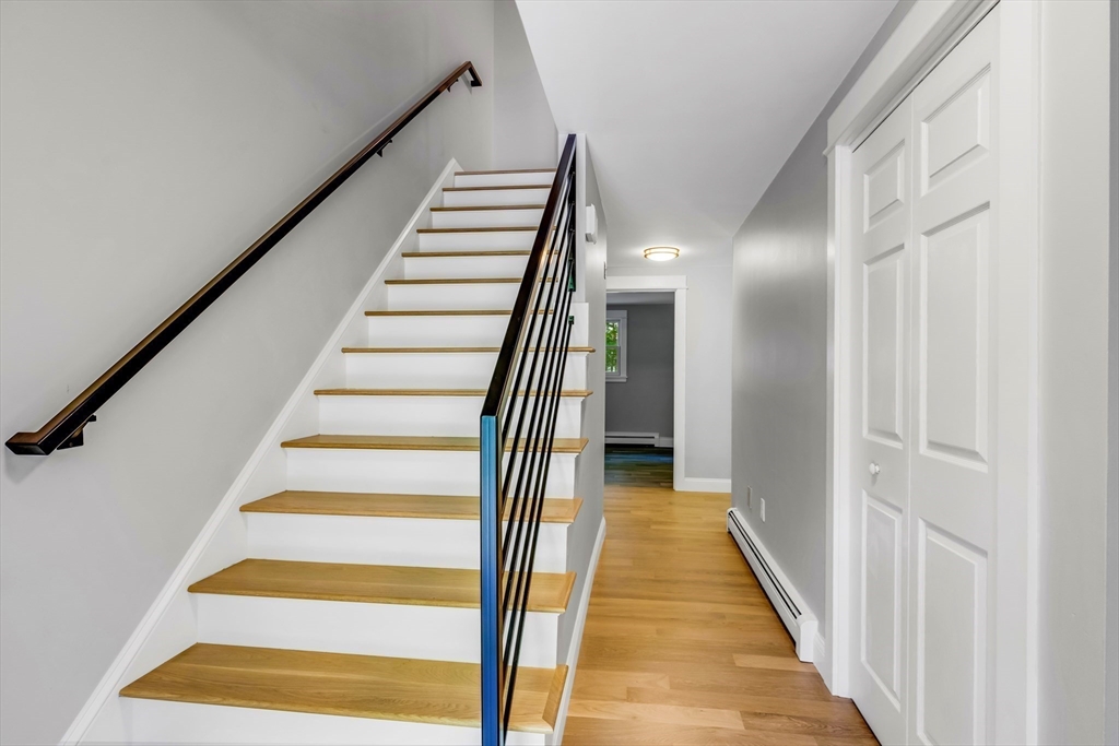 39 Middle Road, Unit A Newbury, MA 01951 - Photo 13 of 40 a view of a hallway with wooden floor and entryway