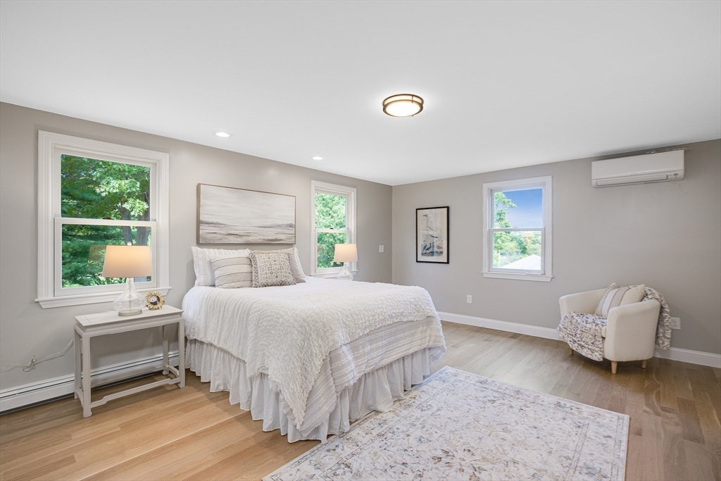 39 Middle Road, Unit A Newbury, MA 01951 - Photo 16 of 40 a bedroom with a large bed and a window