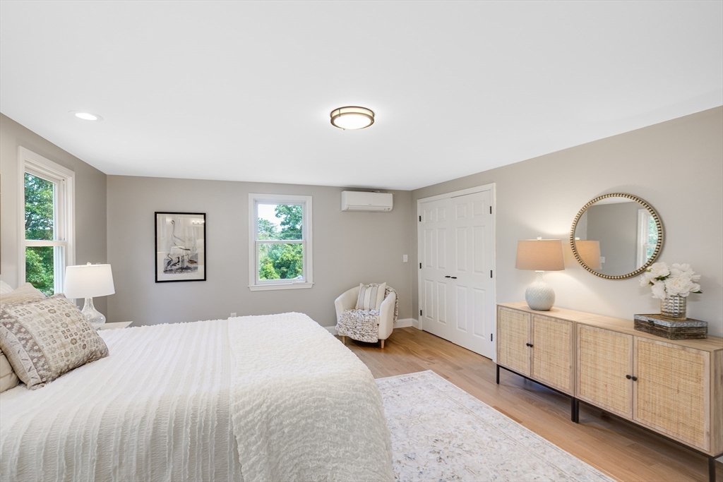 39 Middle Road, Unit A Newbury, MA 01951 - Photo 18 of 40 a bedroom with a granite countertop sink and mirror