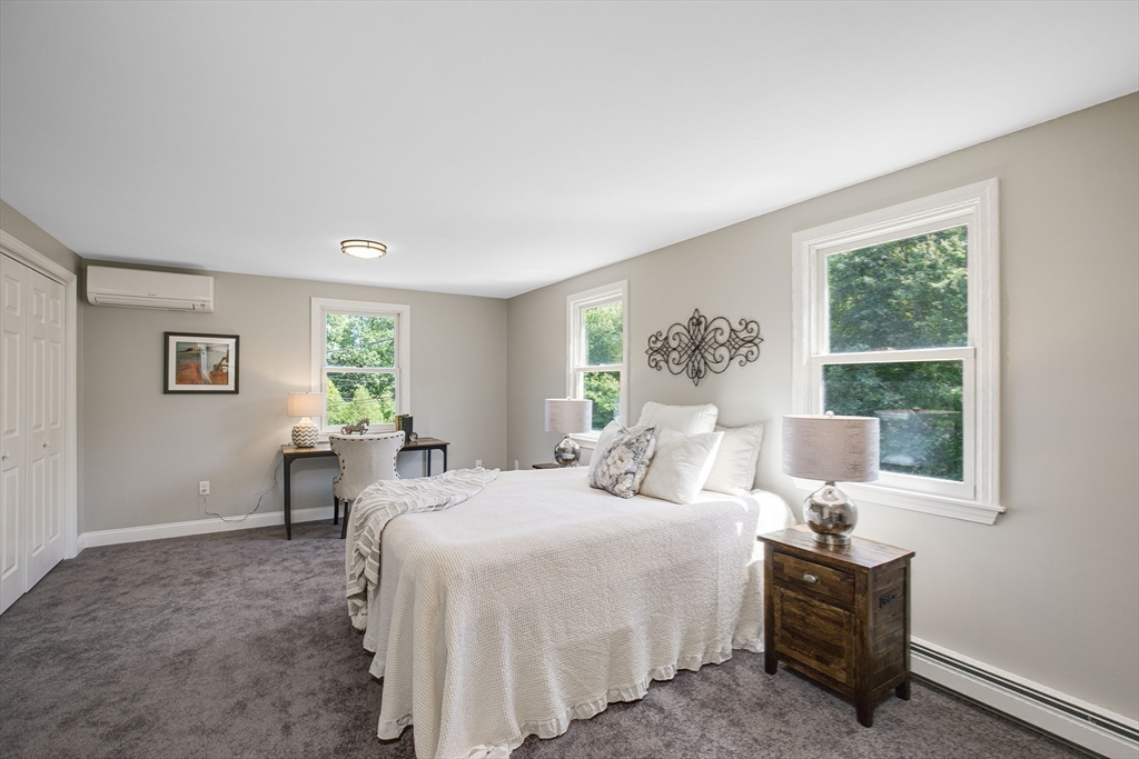 39 Middle Road, Unit A Newbury, MA 01951 - Photo 19 of 40 a bedroom with a bed and a window