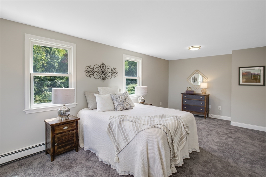 39 Middle Road, Unit A Newbury, MA 01951 - Photo 21 of 40 a bedroom with a bed and a window