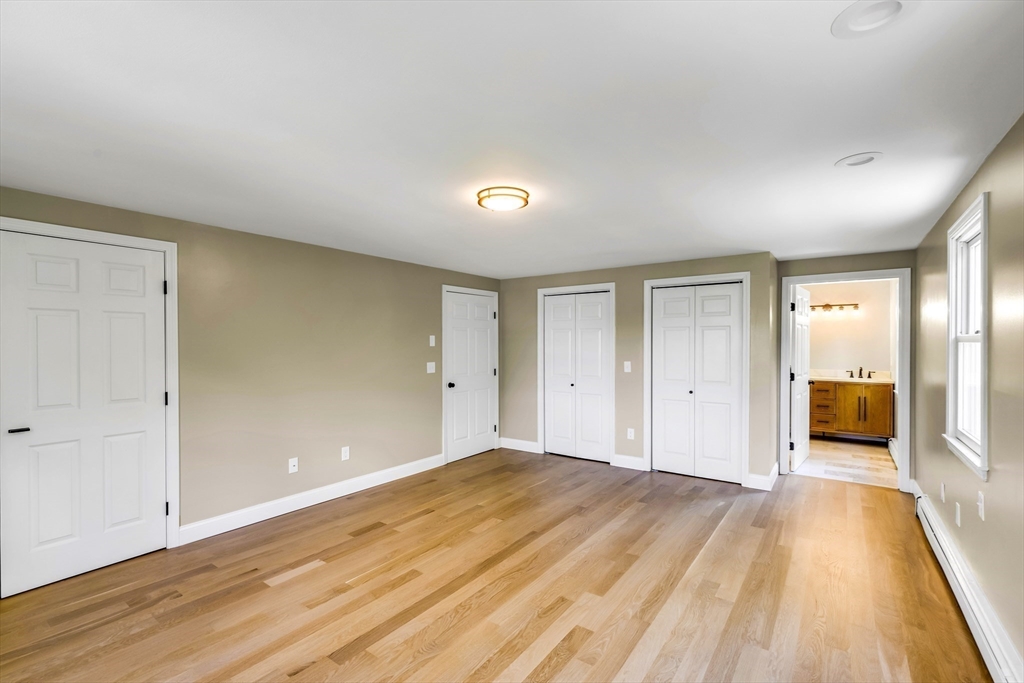 39 Middle Road, Unit A Newbury, MA 01951 - Photo 23 of 40 a view of a room with wooden floor cabinet and a bathroom