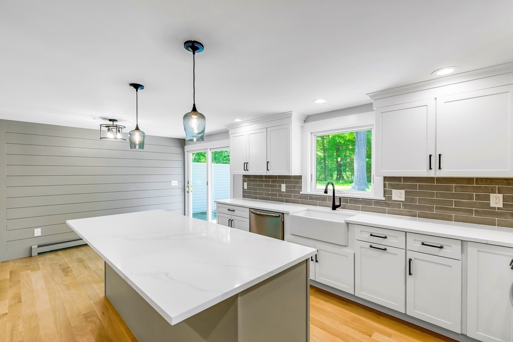 39 Middle Road, Unit A Newbury, MA 01951 - Photo 26 of 40 a kitchen with appliances cabinets and furniture