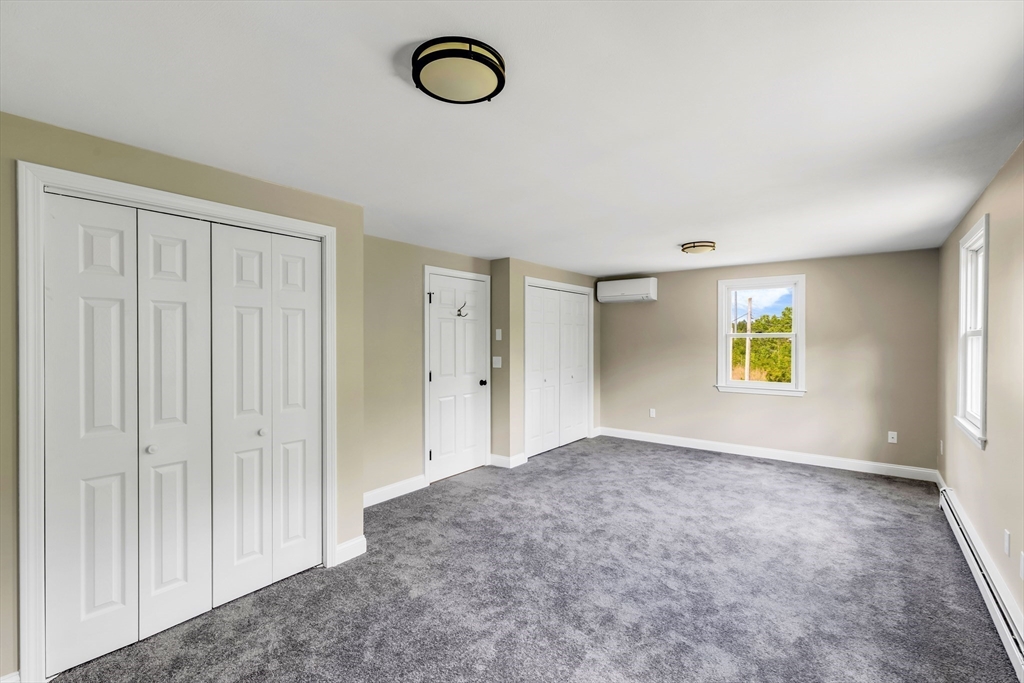 39 Middle Road, Unit A Newbury, MA 01951 - Photo 32 of 40 a view of an empty room with window and closet area