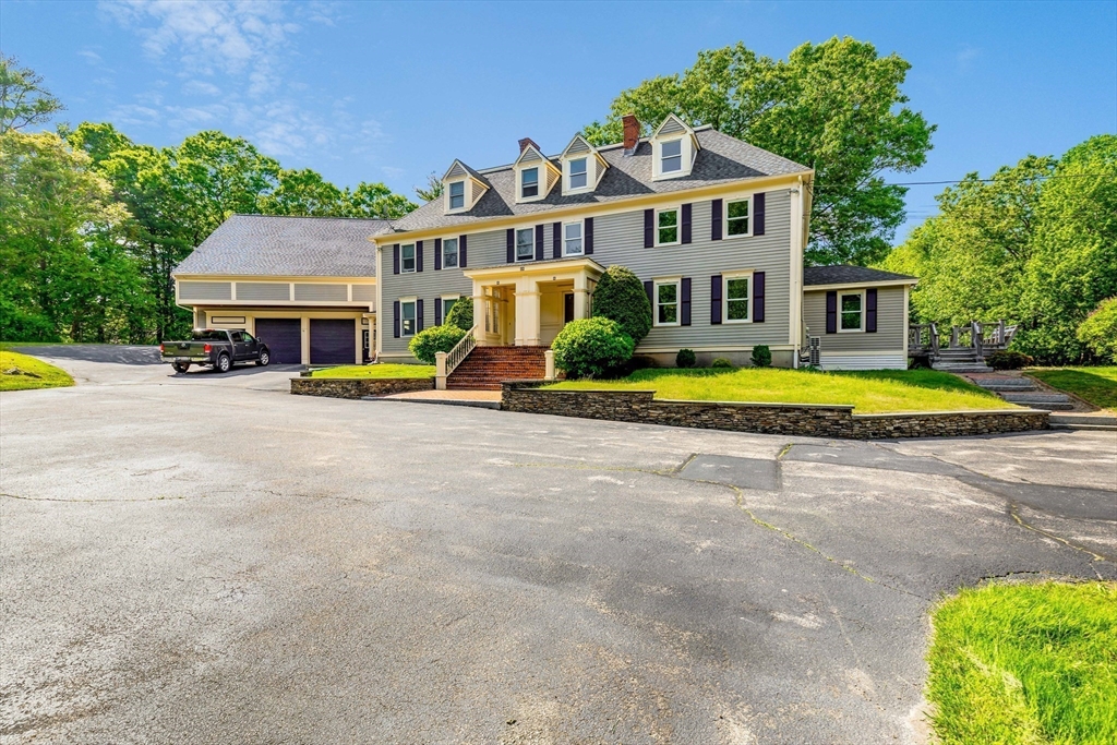 39 Middle Road, Unit A Newbury, MA 01951 - Photo 35 of 40 a front view of a house with swimming pool and porch